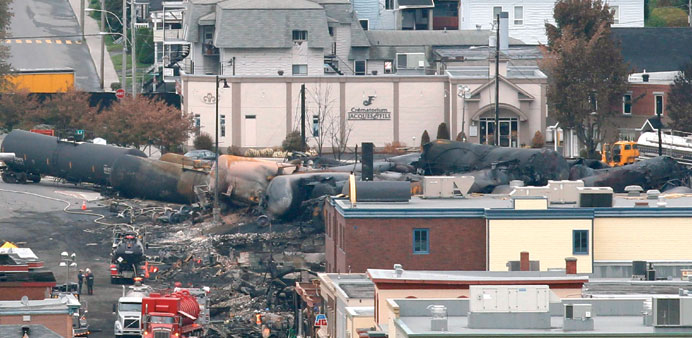 Workers continue digging on the site of the derailment in the town of Lac-Megantic, Quebec.