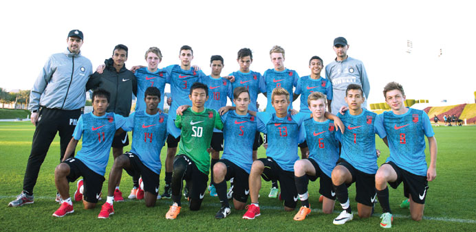 Asian junior footballers pose for a group picture at the Nike camp at Aspire Academy