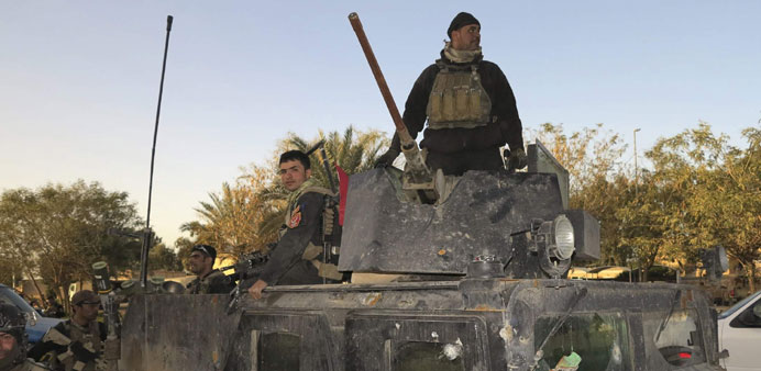 Iraqi SWAT troopers deploy on the outskirts of Ramadi on January 30.