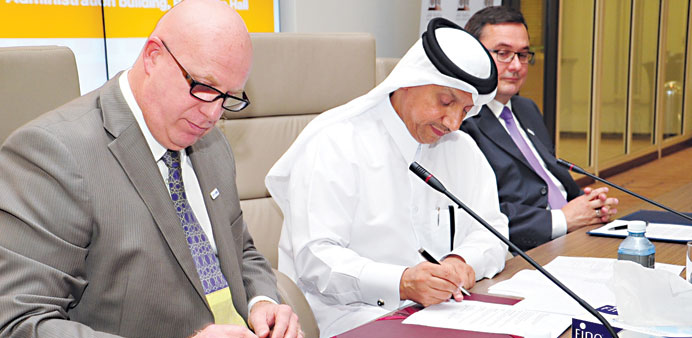 Oryx GTL and QU officials signing the MoU.