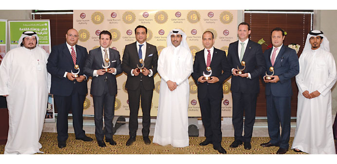 The award winners with QTA chairman Issa bin Mohamed al-Muhannadi.