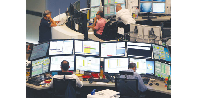 Brokers work in front of screens at the stock exchange in Frankfurt. The DAX 30 rose 0.53% to 11,735.72 points yesterday.