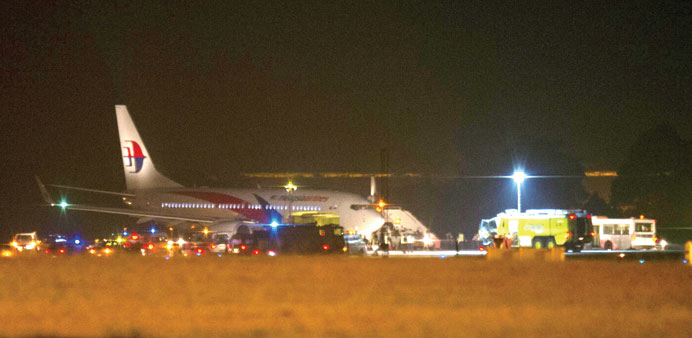 Malaysian Airline flight MH192 is seen on the tarmac after an emergency landing at the Sepang International Airport, outside Kuala Lumpur yesterday.