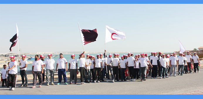 Participants of QRCu2019s 5,000-step Walkathon at the Al Khor Corniche.