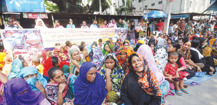 Garment workers during a rally in Dhaka yesterday.