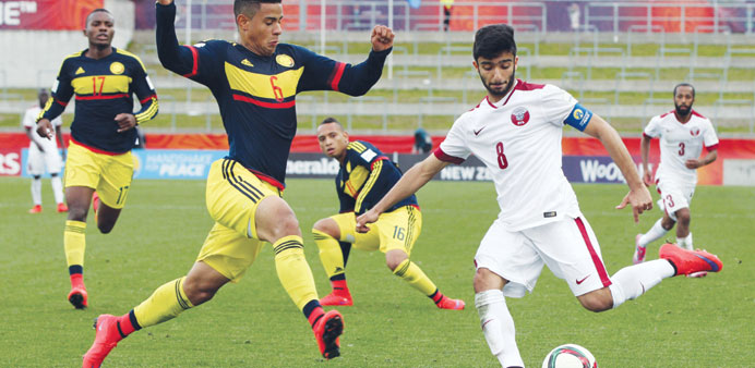 Qataru2019s Ahmed Moein (right) in action against Colombia