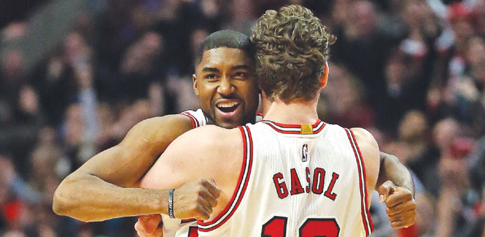 Eu2019Twaun Moore (left) of the Chicago Bulls gets a hug from teammate Pau Gasol after hitting the game-winning three point shot against the Oklahoma City