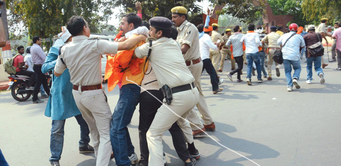 Police detain an ABVP activist during a protest near the state assembly in Patna yesterday.