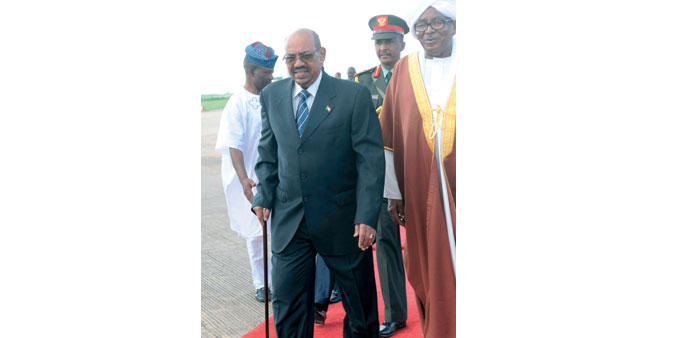 Bashir arrives at the airport in Abuja yesterday.