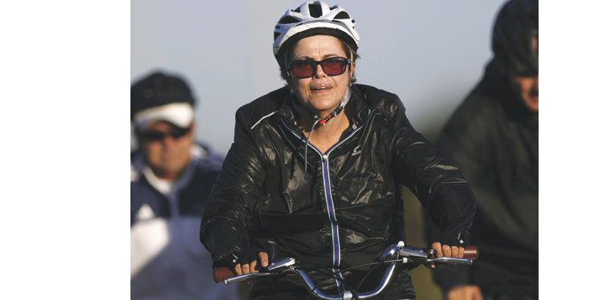 Brazilu2019s President Dilma Rousseff rides her bicycle near the Alvorada Palace in Brasilia yesterday.