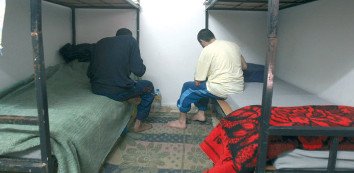 Palestinians charged with collaborating with Israel sit at a prison in Gaza City.