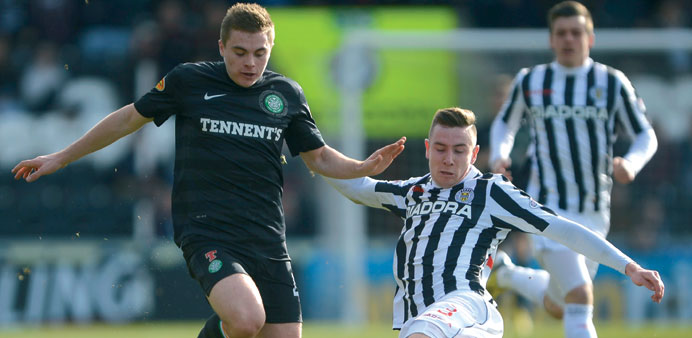 St Mirrenu2019s Paul Dummett challenges Celticu2019s James Forrest during their Scottish FA Cup 6th round match at St Mirren Park Stadium in Paisley yesterday