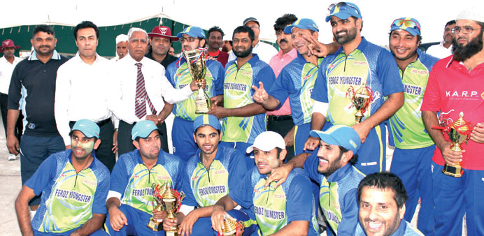 The victorious Al Feroz Youngsters team with the trophy.