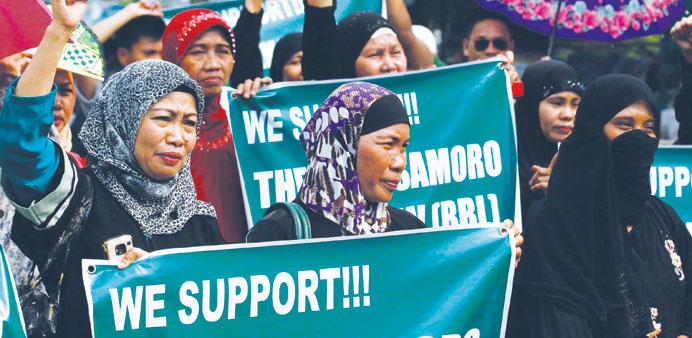 Filipino Muslims rally in support of the Comprehensive Agreement on the Bangsamoro (CAB), near the Malacanang presidential palace in Manila yesterday.
