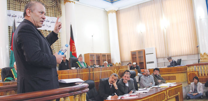 Sher Khan Farnoud, the former chairman of Kabul Bank, attends a hearing at a court in Kabul yesterday.
