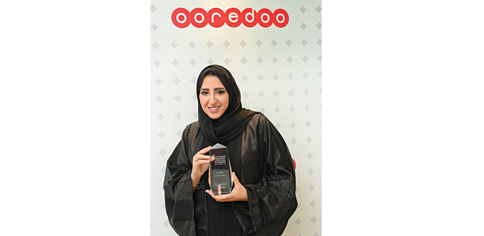 Ooredoo senior analyst (devices and partnerships) Maha al-Khulaifi received the award in Dubai.