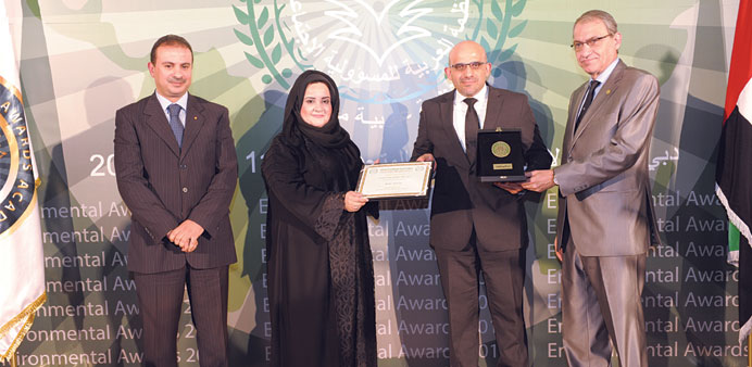 El-Zagha, second right, receiving the award on behalf of Doha Bank in Dubai.