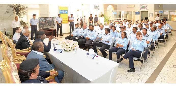 Officials addressing instructors of Gulf Driving School.
