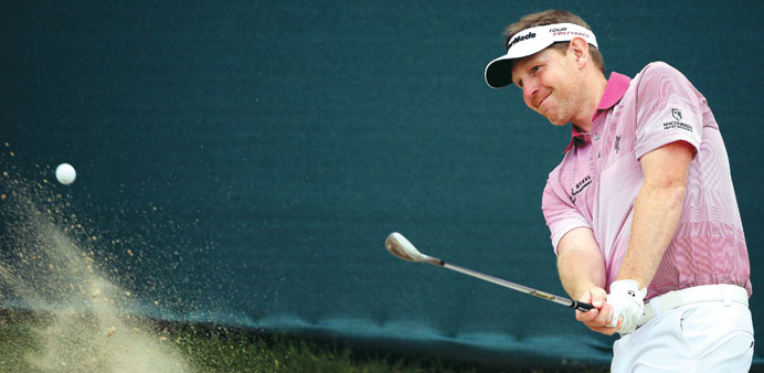 Stephen Gallacher of Scotland plays a bunker shot during the third round of the Omega Dubai Desert Classic at Emirates Golf Club in Dubai yesterday.
