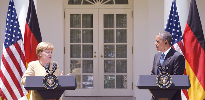 Gap between them: Obama and Merkel at the press conference in the Rose Garden of the White House.