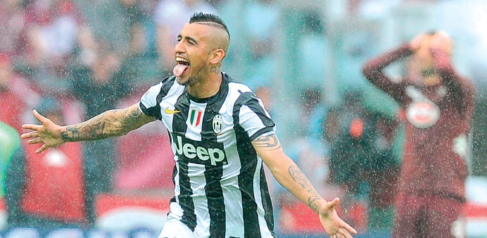 Juventusu2019 Chilean midfielder Arturo Vidal celebrates after scoring against Torino FC during the Serie A match at Olimpico stadium in Turin on April 28