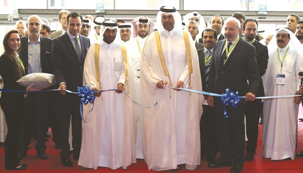 HE the Minister of Economy and Commerce Sheikh Ahmed bin Jassim bin Mohamed al-Thani leads the ribbon-cutting ceremony during the official opening of Project Qatar 2016  at the Doha Exhibition and Convention Centre yesterday. PICTURE: Shemeer Rasheed