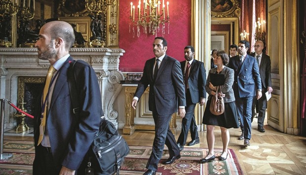 Qataru2019s Foreign Minister HE Sheikh Mohamed bin Abdulrahman al-Thani (centre)  arrives to attend a meeting about Syria at the French foreign ministry in Paris yesterday.