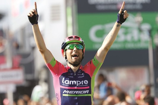 Italian cyclist Diego Ulissi celebrates after winning the 4th stage of the 99th Giro du2019Italia. (AFP)