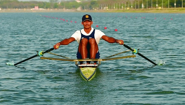 Indian rower Dattu Bhokanal takes part in a training session at the College of Military Engineering in Pune. Bhokanal has qualified for the summer Olympics in Rio in August. (AFP)