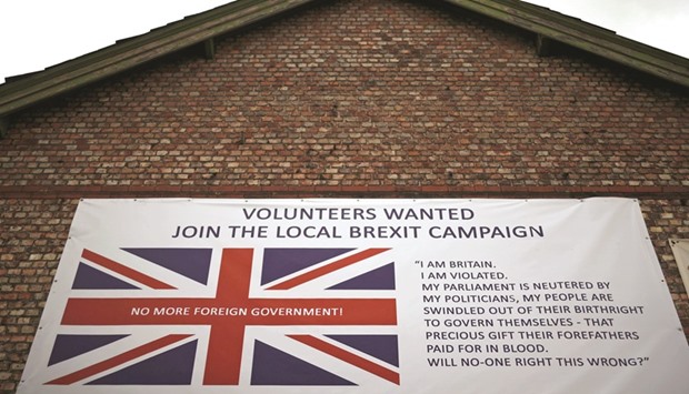 A banner encouraging people to support a local Brexit campaign hangs on the side of a building in Altrincham, Britain.