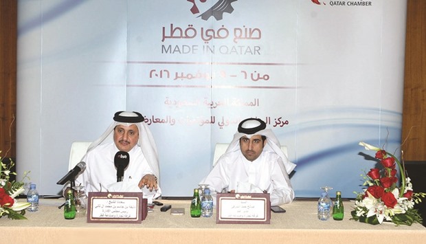 Sheikh Khalifa (left) and al-Sharqi talking to the local media.