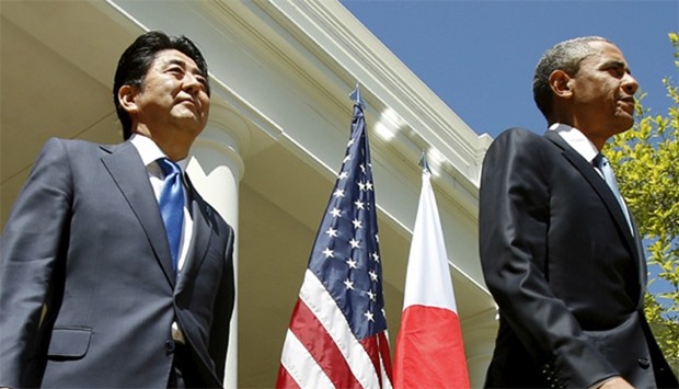 US President Barack Obama and Japanese Prime Minister Shinzo Abe arrive for a joint news conference