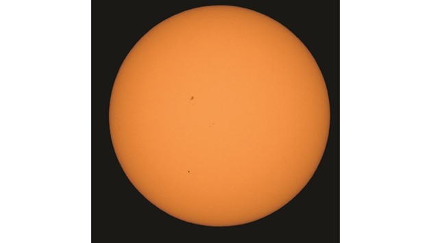 Mercury is seen in silhouette, in the lower third of the image, as it transits across the face of the Sun on Monday, as viewed from Boyertown, Pennsylvania.