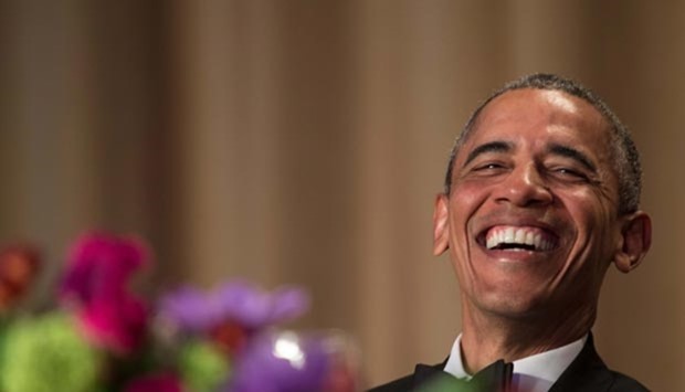 President Barack Obama laughs during the 102nd White House Correspondents' Association Dinner in Washington, DC.