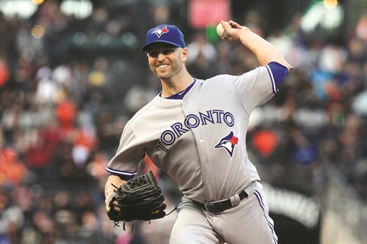 Toronto Blue Jays starting pitcher J.A. Happ (33) throws to the San Francisco Giants in the first inning of their MLB baseball game.