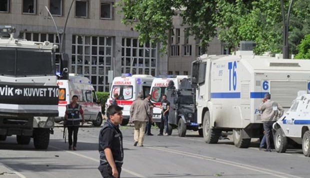 Police officers secure the area after an explosion in front of the city's police headquarters in Gaziantep on Sunday.