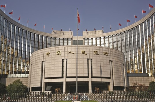 The Peopleu2019s Bank of China headquarters is seen in Beijing. The PBoC removed quotas for most overseas financial institutions to invest in the interbank bond market in February, after lifting such caps for central banks and sovereign wealth funds last June.