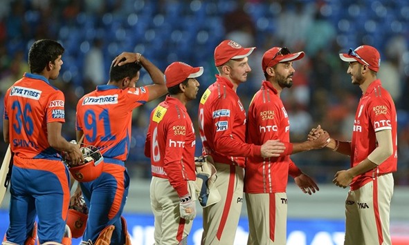 WELL BOWLED: Kings XI Punjab captain Murali Vijay (2nd right) and other players greet teammate hat-trick bowler Axar Patel (right) after their 23-run win over Gujarat Lions in their Indian Premier League clash in Rajkot yesterday. (AFP)