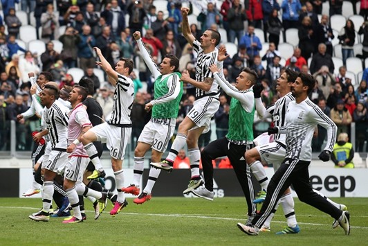 Juventusu2019 players celebrate after winning the Italian Serie A match against Carpi in Turin. (AFP)