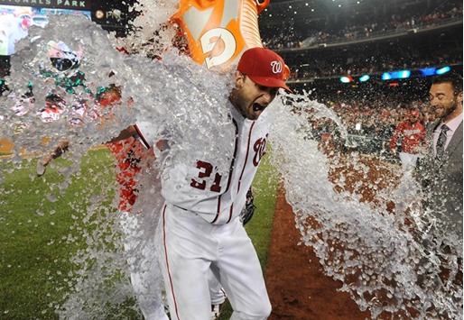 Washington Nationals starting pitcher Max Scherzer is doused with water after striking out an MLB record 20 batters against the Detroit Tigers at Nationals Park. The Washington Nationals won 3-2. PICTURE: USA TODAY Sports