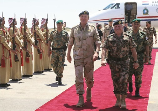 A Jordanian Royal Palace handout photo of King Willem Alexander of the Netherlands walking alongside Jordanu2019s King Abdullah II upon his arrival in Amman yesterday.