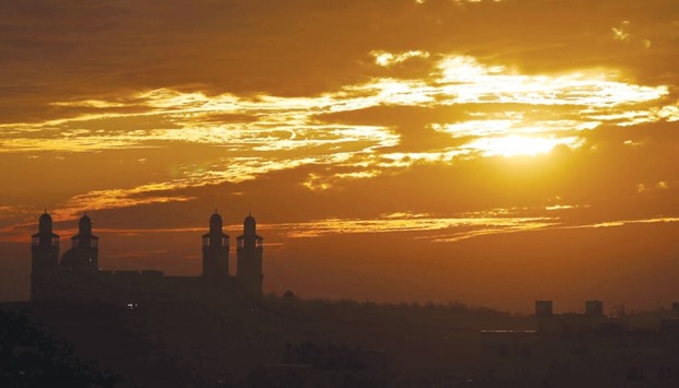 The King Hussein Bin Talal Mosque is seen as the sun sets in Amman, Jordan.