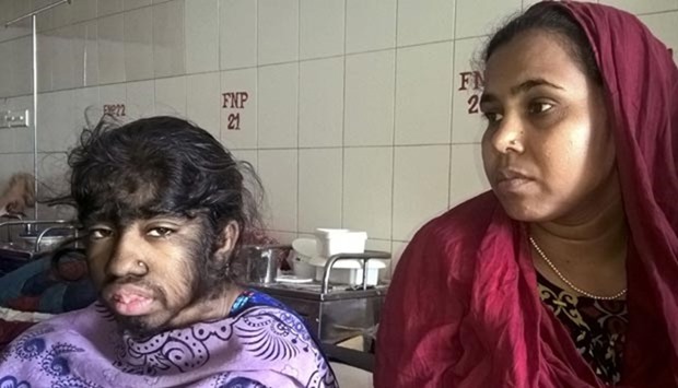 Bithi Akhtar and her mother wait in a ward at a Dhaka hospital