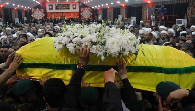 Members and supporters of Hezbollah, carry the coffin of Mustafa Badreddine