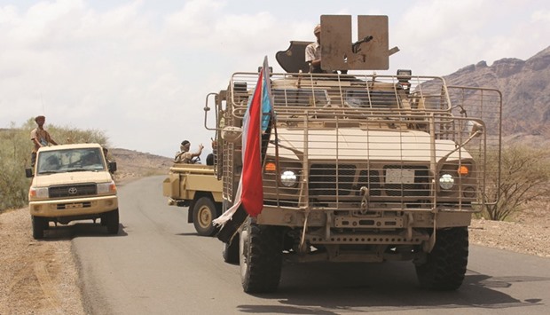 Pro-government forces fighting against Houthi militants re-group on a road in Al Karsh in Yemenu2019s southern Lahj province yesterday.
