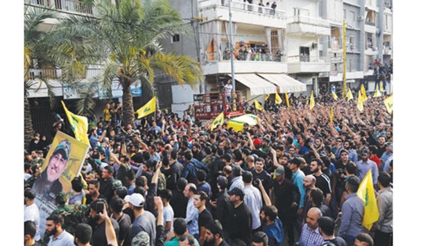 Members and supporters of Lebanese group Hezbollah carry the coffin of Mustafa Badreddine, a top commander of the group, who was killed in an attack in Syria, during his funeral in the Ghobeiry neighbourhood of southern Beirut yesterday.