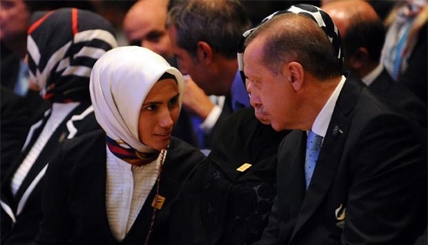 Turkish President Recep Tayyip Erdogan speaks with his daughter Sumeyye in this picture taken in 2013.