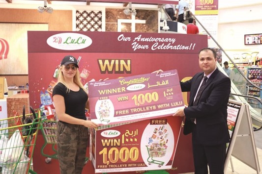 Wioleta Barbara Widelska, a Poland national receiving her u201cpriced trolleyu201d from the LuLu Customer Service manager at Lulu Hypermarket, D-Ring Road yesterday.