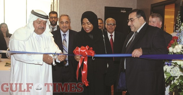 Sheikh Faisal opening the exhibition by cutting the ribbon.