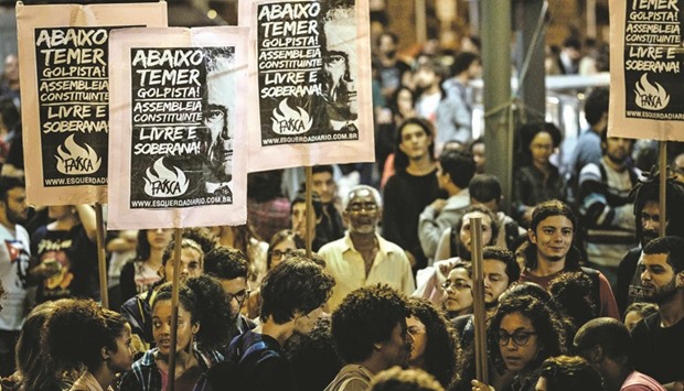 Activists protest against Brazilu2019s acting President Michel Temer in Rio de Janeiro on Friday night.